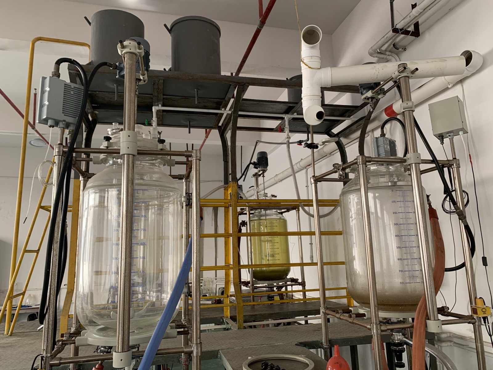 Aurexene Materials laboratory benches with beakers, materials, and formulation equipment.