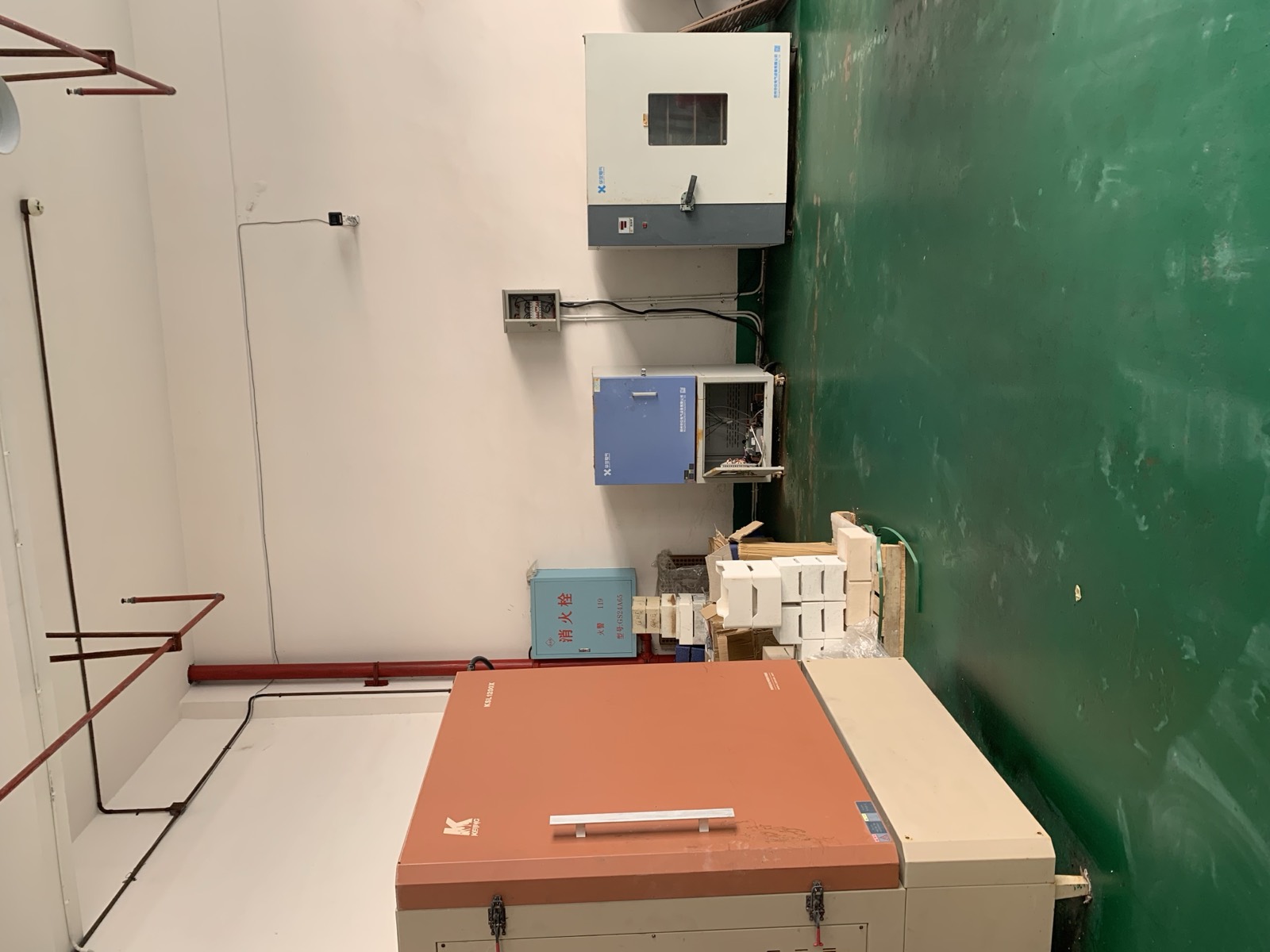 Environmental test equipment and sample materials in the Aurexene Materials lab area.